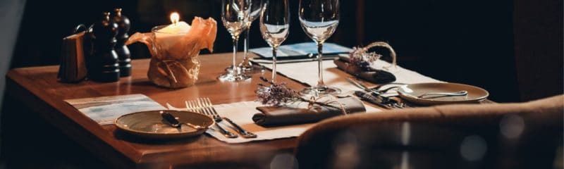 a picture of a restaurant table with tableware